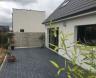 Terrasse  réalisée en pavés résine Marshalls  Vulcan Belgium Blue  par NORD ESPACE CONCEPTION à Les Rues des VIGNES